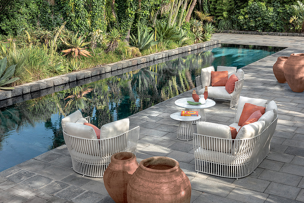 An outdoor terrace with furniture from the Venexia collection by Ethimo