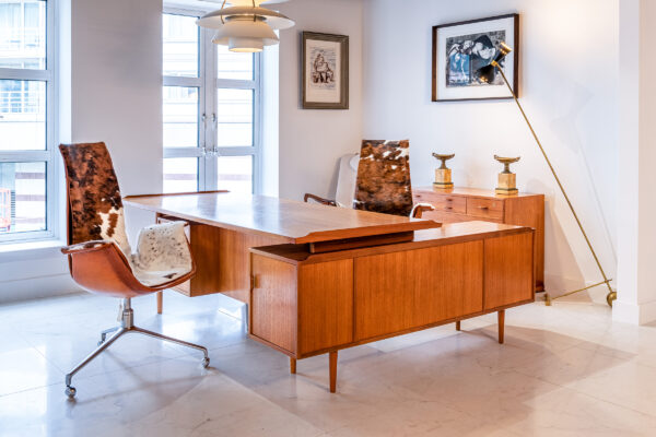 A vintage rosewood desk in the Antique Modern Mix showroom at the Design Centre