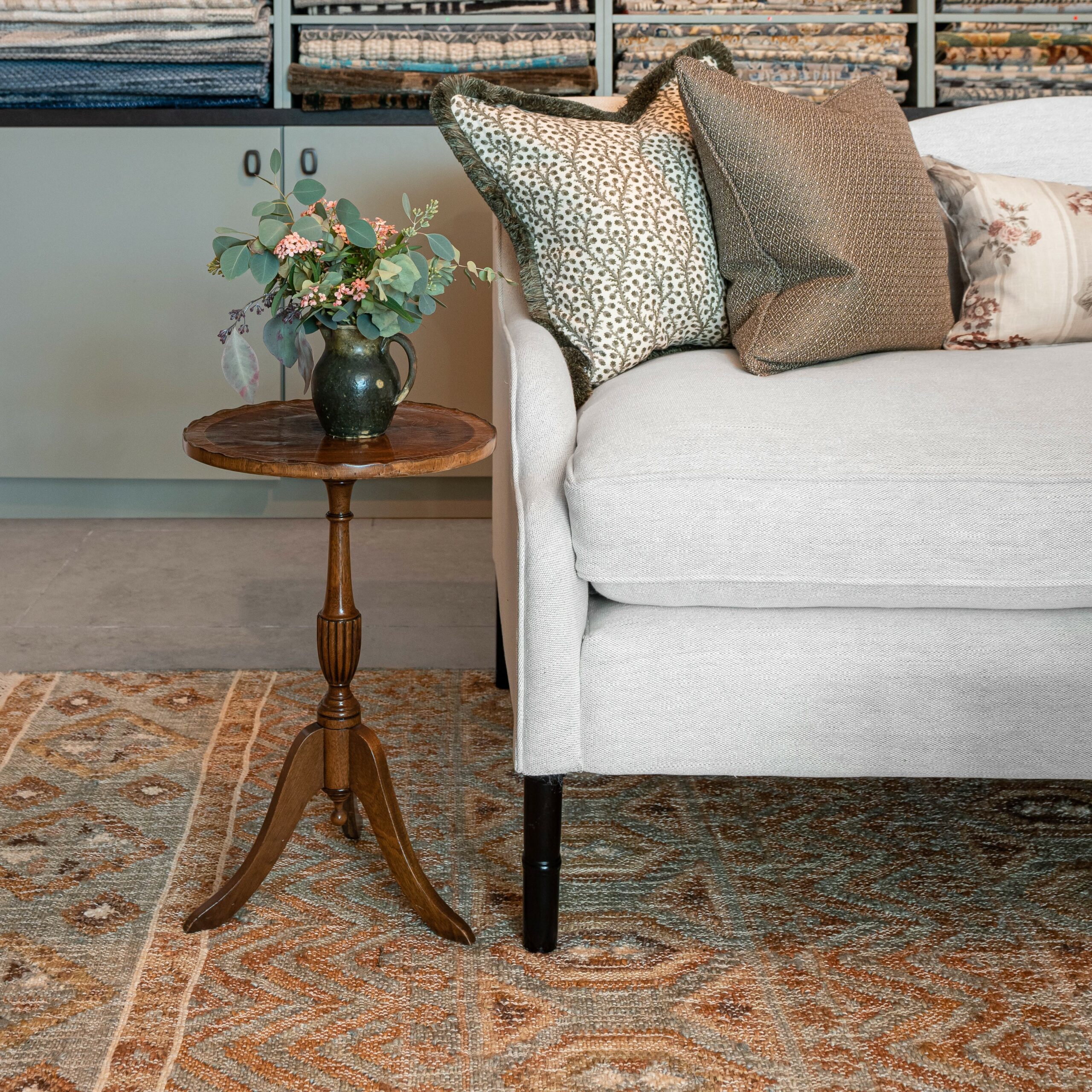 A detail of a sofa and the 'Una' rug by Sims Hilditch from Tim Page Carpets