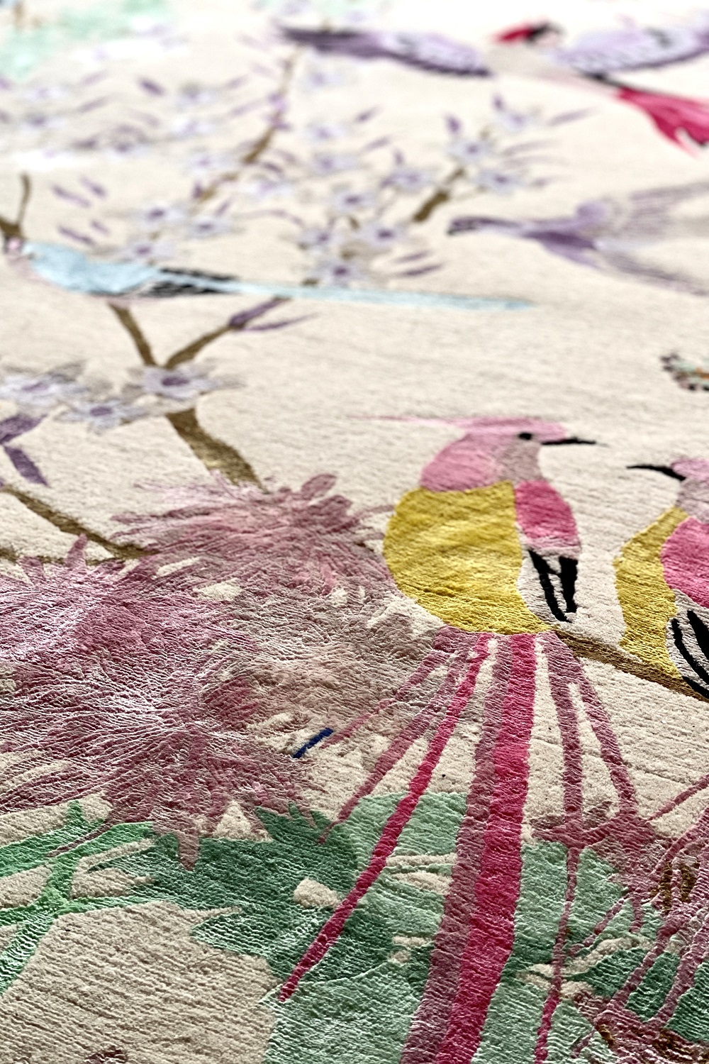 A detail of Wendy Morrison Design's 'One Hundred Birds One Hundred Flowers' hand-knotted wool and silk rug